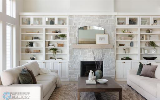 Stone Surround Gas Fireplace with Custom Built In Cabinets