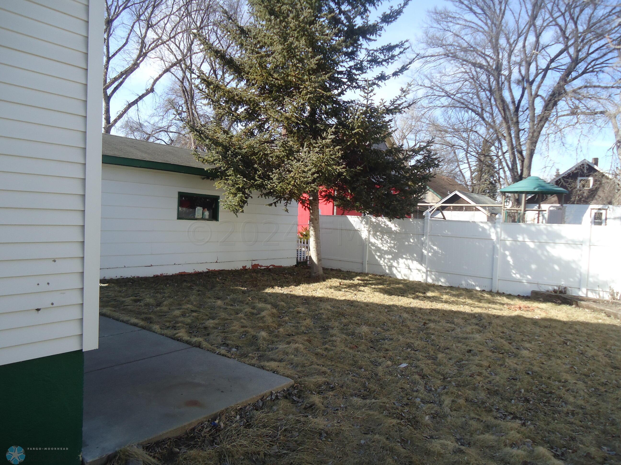 partially fenced back yard